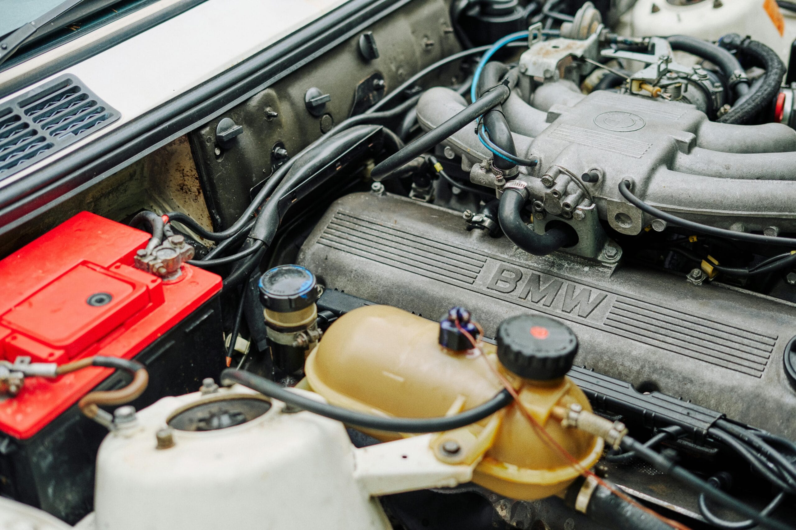bmw engine bay with new battery