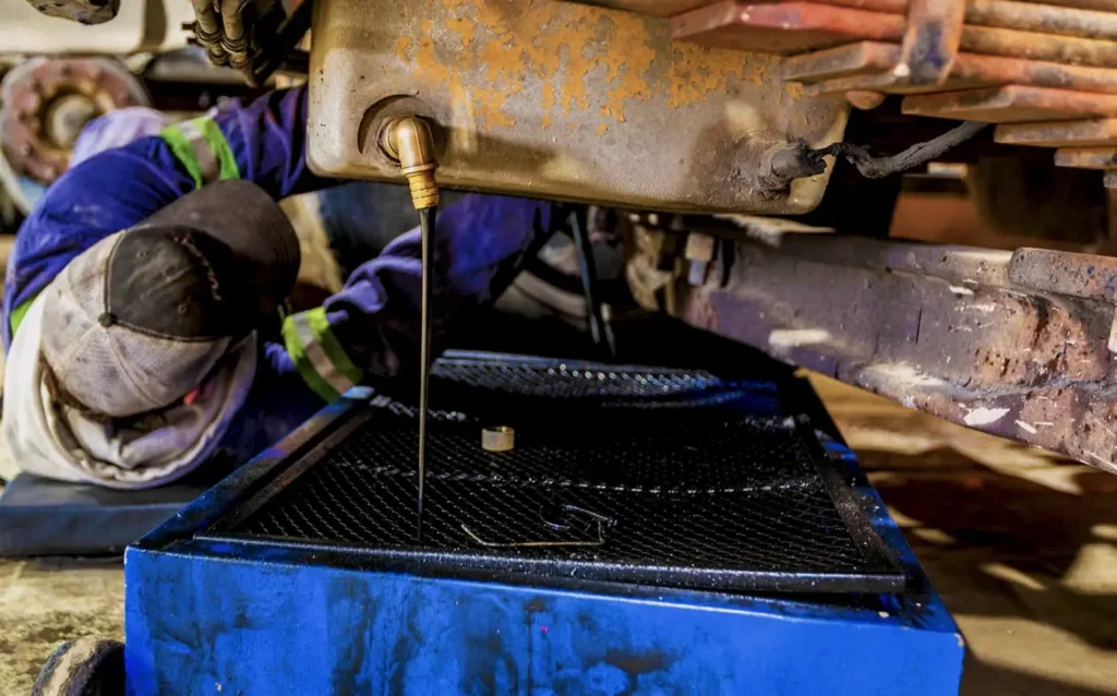 heavy equipment oil change from the oil pan