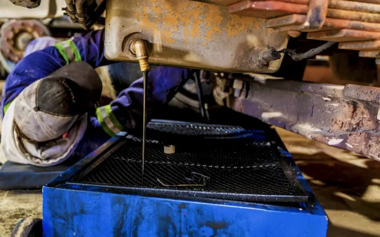 heavy equipment oil change from the oil pan